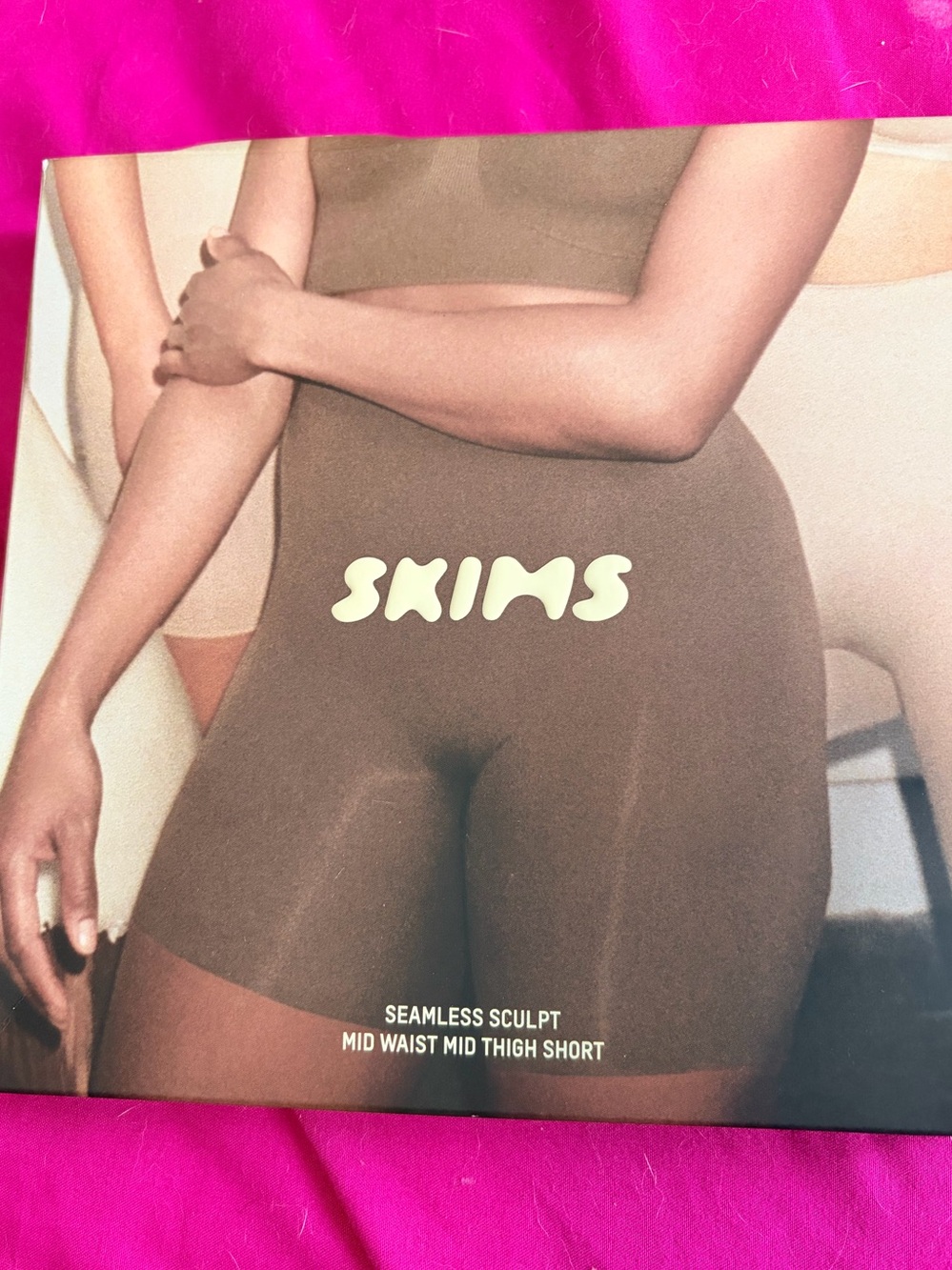 SKIMS Mid-Waist Mid-Thigh Shaping Short in Bronze -size small